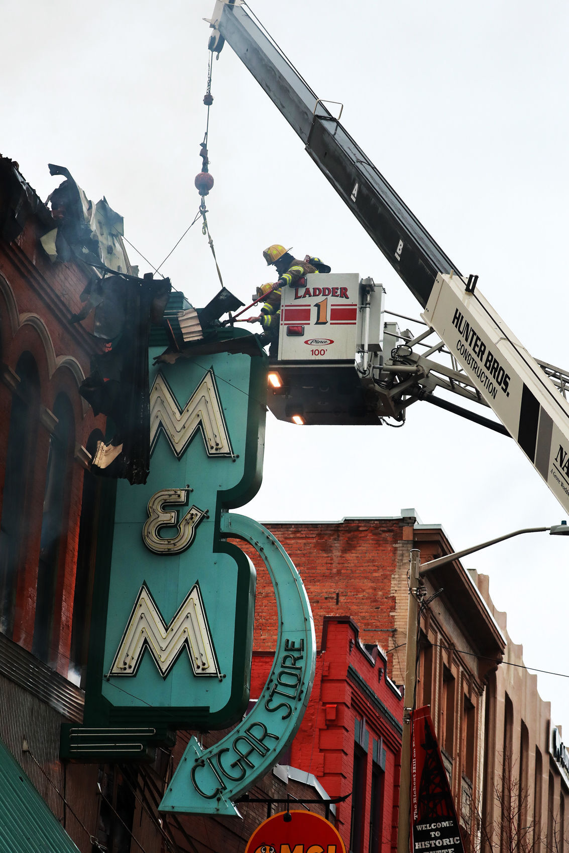 Butte firefighters save iconic M&M sign as fire destorys the historic building